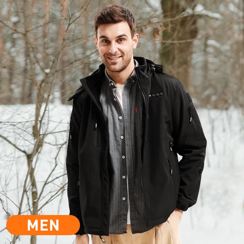 A man is wearing ARRIS 12V heated jacket in the snow