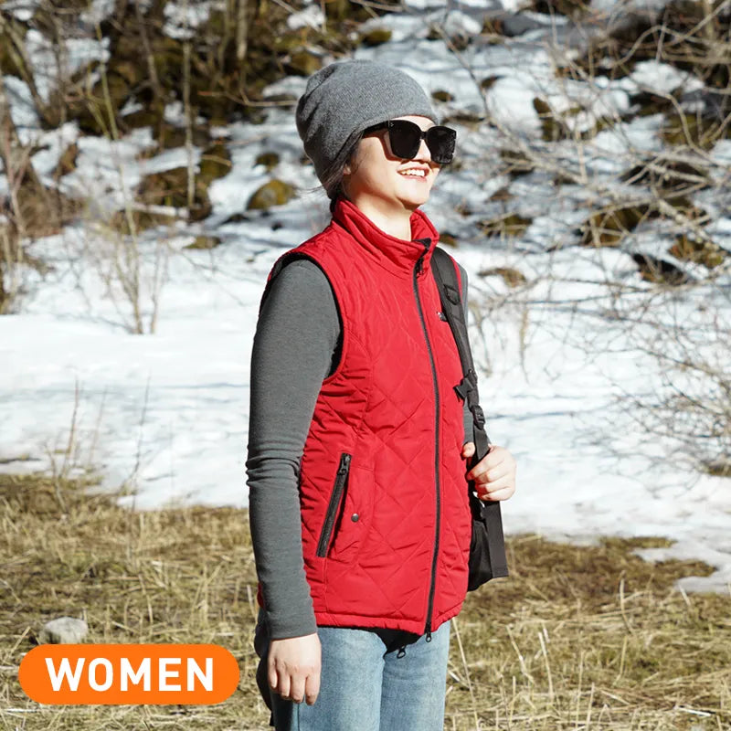 Woman wearing a red ARRIS heated vest and gray beanie in the snow